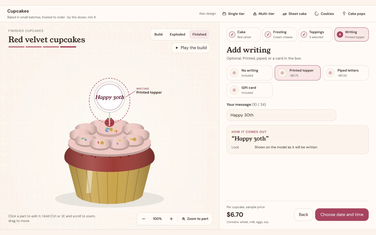 Cupcake builder showing a red velvet cupcake in a gold liner with cream cheese rosettes, sprinkles and a printed Happy 30th topper, $6.70 per cupcake